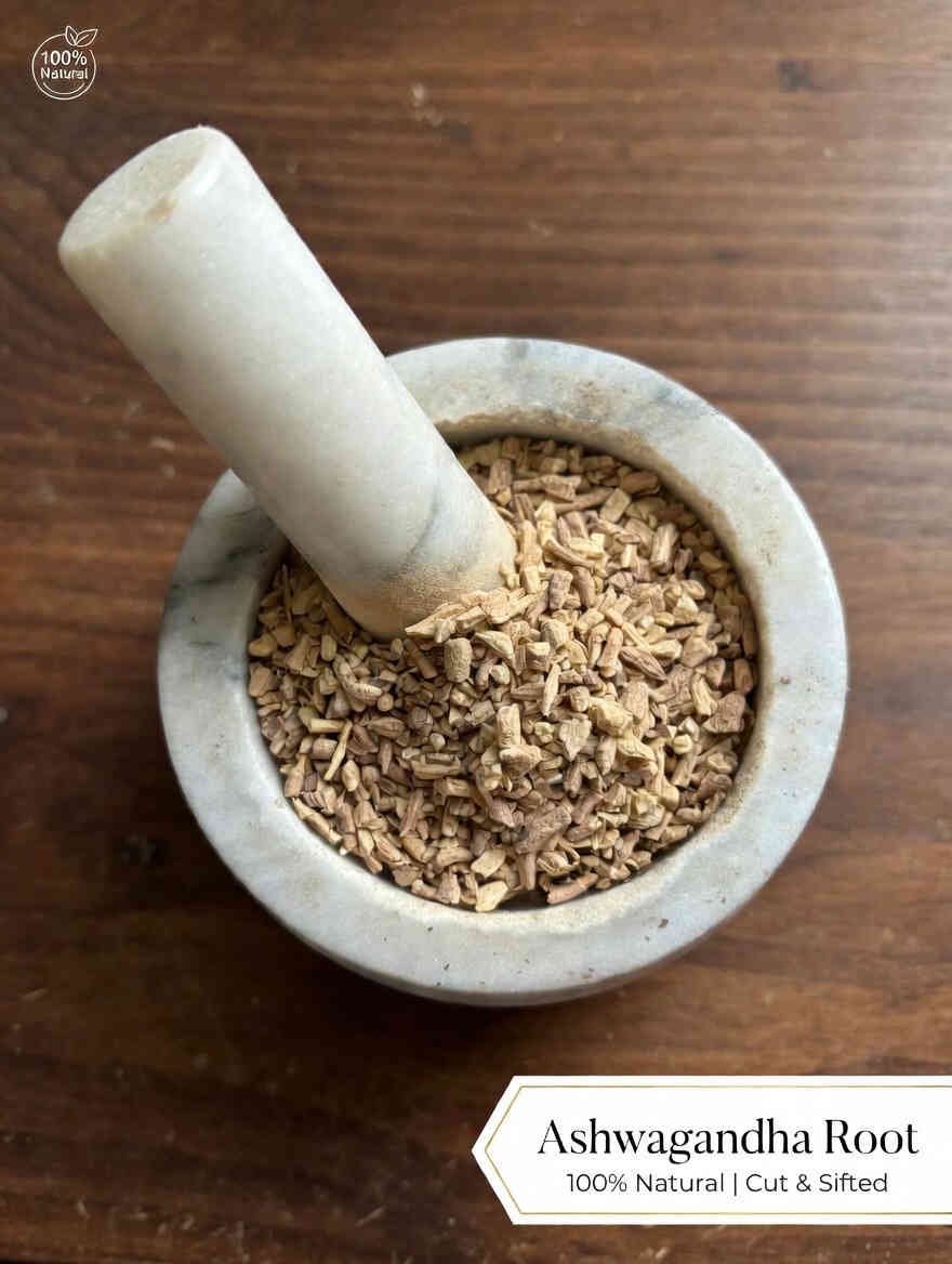 Ashwagandha root cut and sifted in a mortar and pestle with Withania somnifera plant background - The Herb Peddler