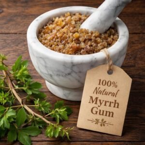 Myrrh gum resin in a mortar and pestle with Commiphora myrrha tree background - The Herb Peddler