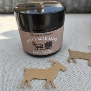 Burn Soother Goat's Milk Salve in an amber jar with lavender and chamomile flowers infused - The Herb Peddler