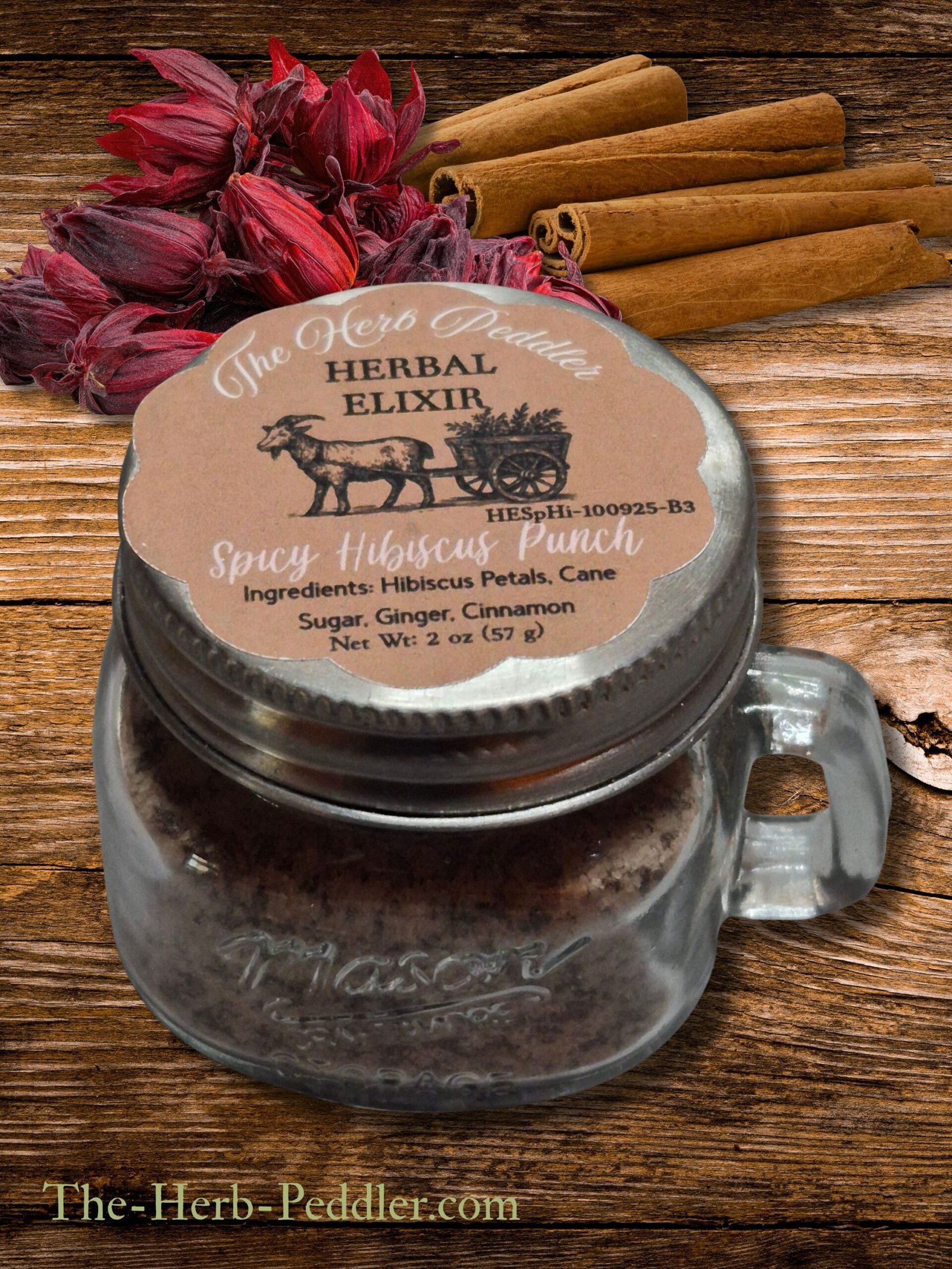 Master Herbalist Spicy Hibiscus Punch Elixir in a 2 oz mini Mason jar - ginger, cinnamon, and hibiscus tea blend.