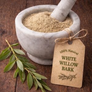 White Willow bark in a mortar and pestle with Salix alba plant background - The Herb Peddler